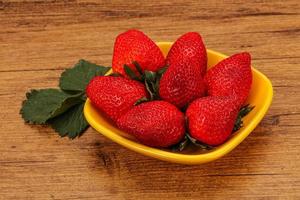 Ripe sweet strawberry with leaf photo