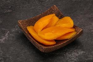 Sweet mango slices in syrop photo