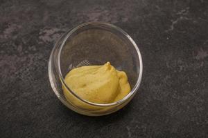 Dijon mustard sauce in the bowl photo