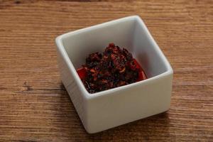 Fried chili pepper sauce with oil photo