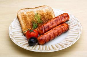 Grilled sausages with toast photo