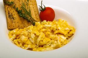 Scrambled eggs with tomato photo