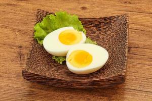 Boiled egg slices in the bowl photo