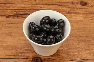 Black olives in the bowl photo