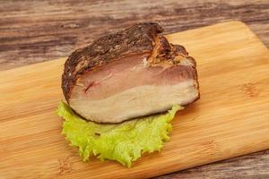 Homemade Smoked pork peat with spices photo