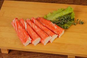 Crab sticks served salad leaves photo