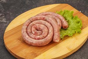 Raw sausage ring for grill photo