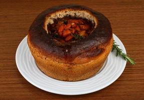 Bean soup in bread photo