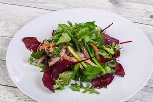 Mix salad with meat and asparagus photo