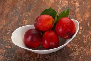 Sweet tasty ripe few nectarines photo