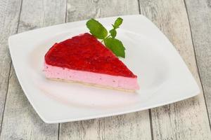 Soft Raspberry cheesecake served mint photo