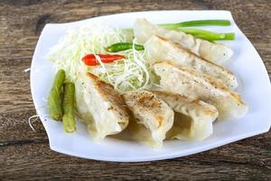 Japanese dumplings on plate photo