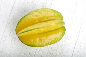 Carambola on white wood photo