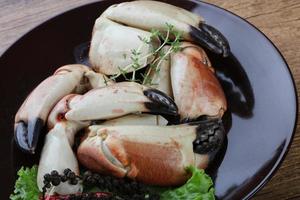 Crab claws on plate photo