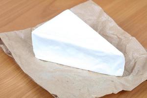 Brie cheese on paper photo