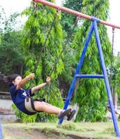 Young girl with swings. photo