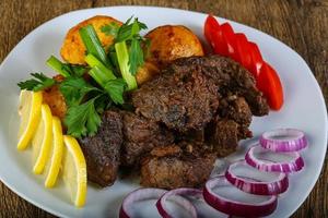 Grilled liver on plate photo