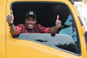 Smiling Truck Driver Man thumbs up satisfied service transport photo