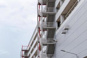 Side view on the exterior walkway and emergency exit stairs on the car park photo