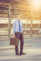 Portrait of Smiling Business man in the city, Success and Happiness concept. photo