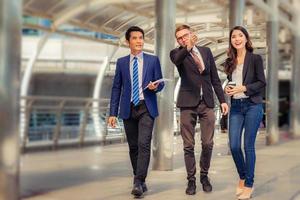 Business man and businesswomen over blurred city background, Success and Happiness Team Concept photo