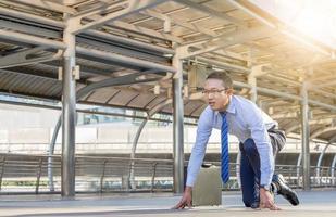 Business man in start position runner city background, Start for success concepts photo