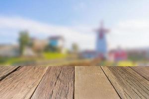 Empty wooden table top perspective with blurred background, used for montage or display your products photo