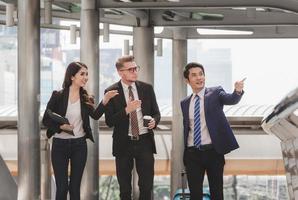 Business man and businesswomen over blurred city background, Success and Happiness Team Concept photo