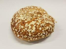 oat bagel on white surface or table photo