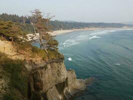 beach and ocean water with waves in Newport, Oregon photo