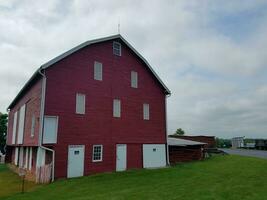 large red barn with no trespassing signs photo