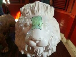 white lion statue with Puerto Rico island drawn on it photo