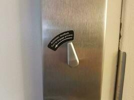 automatic deadbolt turn to engage privacy sign on interior door photo