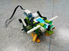 animal robot made from plastic blocks on floor photo