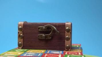 Small treasure box on alphabet wooden block video