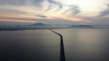 Aerial silhouette car traffic move at Penang Bridge. video