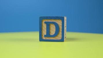 Close up shot letter D alphabet wooden block video