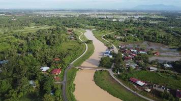 Aerial move over river surrounding by green environment