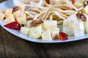 Cheese board on plate photo