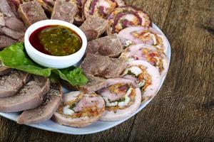 Horse sausages on plate photo