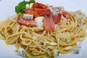 Pasta with salmon and cheese photo