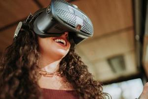 Latin woman with virtual reality glasses. Future technology concept. photo