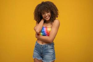 Young curly hair woman lgbt. Alone. Beautiful afro young happy woman with symbol of the LGBT Human Rights, Equality, LGBT photo