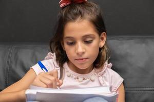 Girl doing homework photo