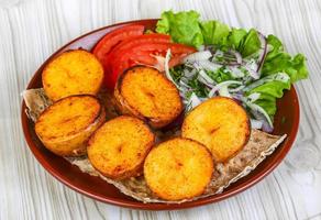 Baked potato dish photo