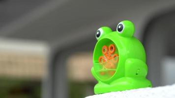 Green frog toy release bubble video