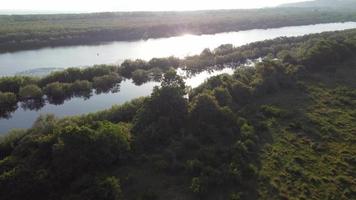 Fly over wetland in back light. video