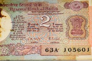 Old Two Rupee notes combined on the table, India money on the rotating table. Old Indian Currency notes on a rotating table, Indian Currency on the table photo