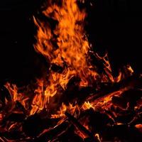 Fire flames on black background, Blaze fire flame texture background, Beautifully, the fire is burning, Fire flames with wood and cow dung bonfire photo