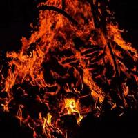 Fire flames on black background, Blaze fire flame texture background, Beautifully, the fire is burning, Fire flames with wood and cow dung bonfire photo